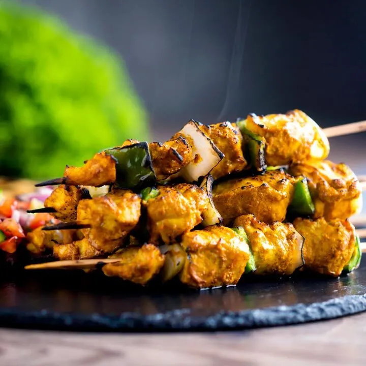 Steaming hot chicken tikka kebab with onion and green pepper