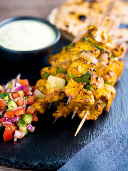 Chicken tikka kebab with onion and green pepper served with kachumber salad & raita