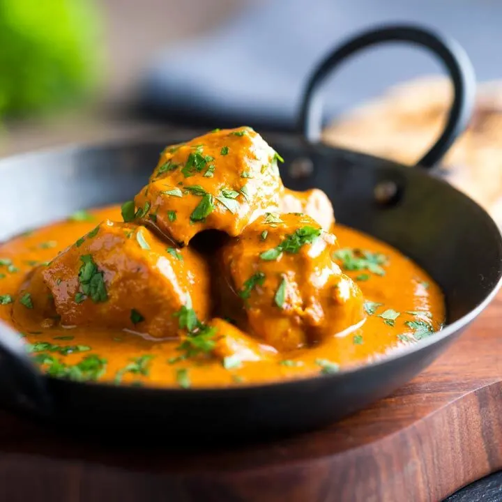 Creamy chicken tikka masala in an iron karai