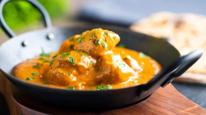 Creamy rich chicken tikka masala curry in an iron karai