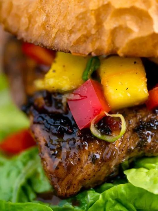 Close up Jamaican jerk chicken burger with a mango salsa