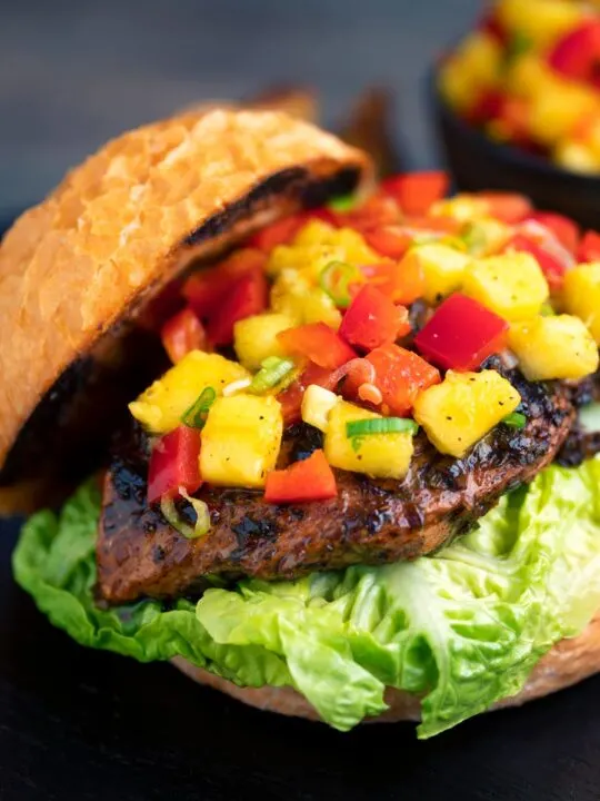 Jamaican jerk chicken burger with a mango salsa served on a toasted bun
