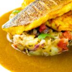 Elegant sea bass fillet curry served with fenugreek potatoes