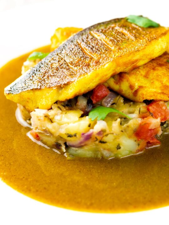 Elegant sea bass fillet curry served with fenugreek potatoes