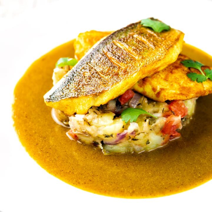 Sea bass curry featuring turmeric fish fillets and tamarind curry sauce & Fenugreek potatoes