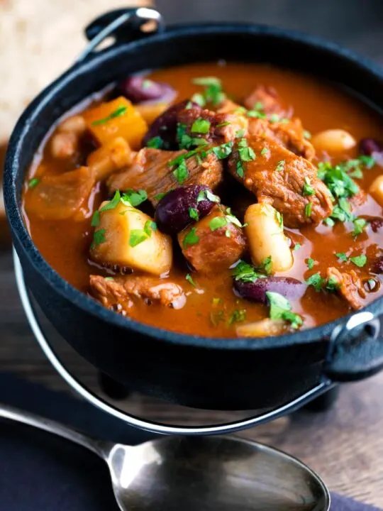 Hungarian bean goulash or babgulyas served in an iron bowl.