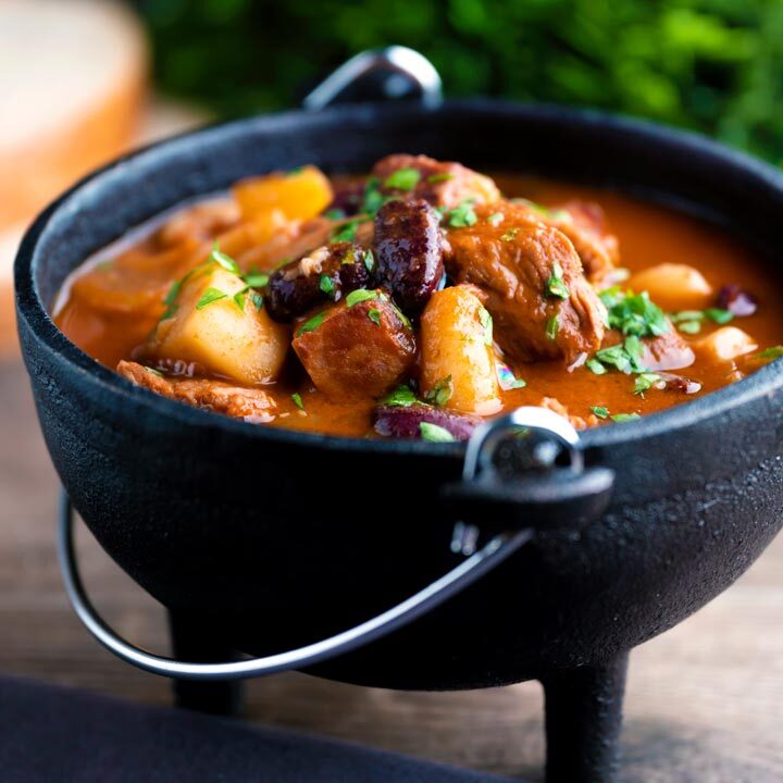 Babgulyas, a Hungarian bean goulash served in a cast iron bowl.