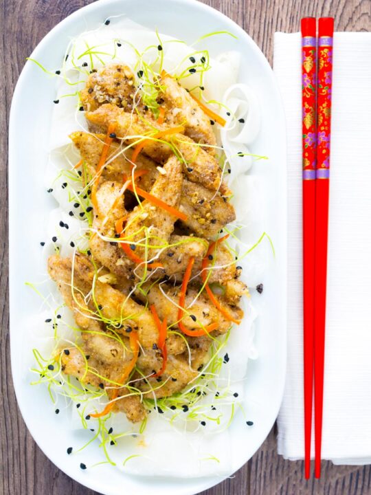 Overhead crispy Chinese salt and pepper chicken with pickled daikon.