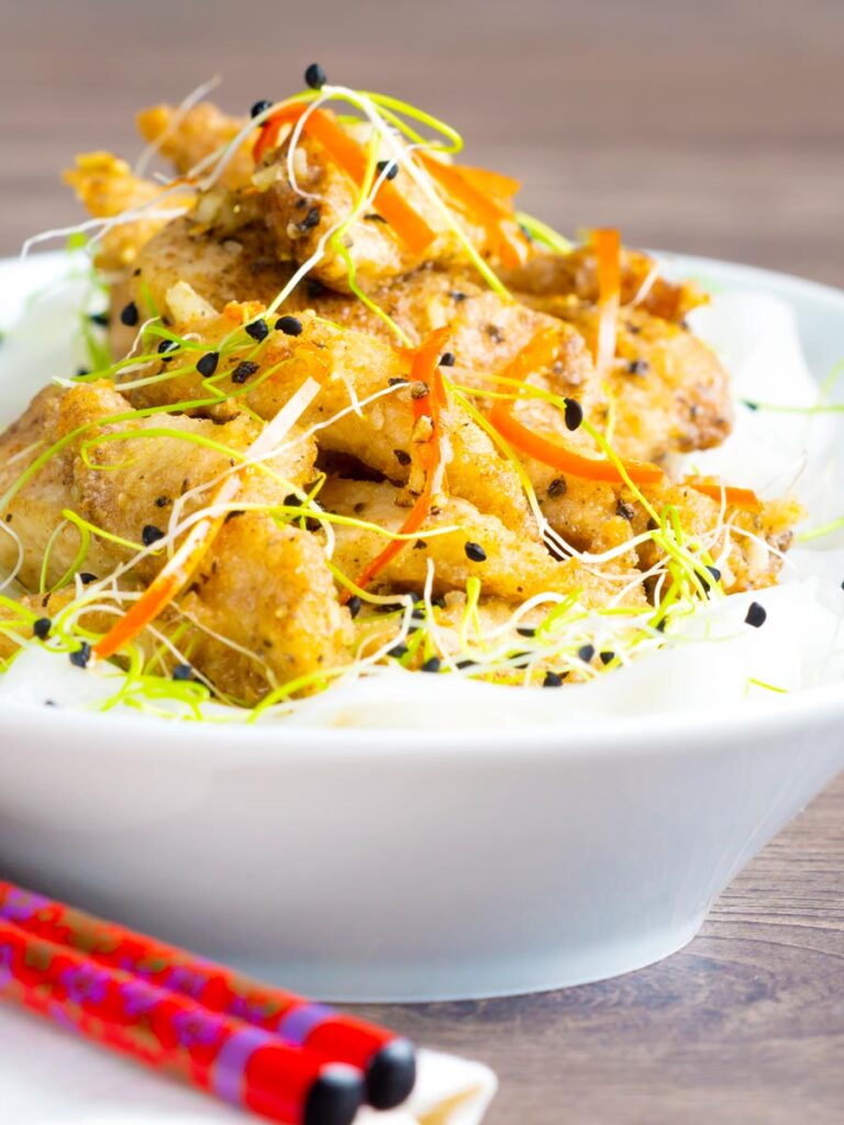 Crispy Chinese salt and pepper chicken with pickled daikon.