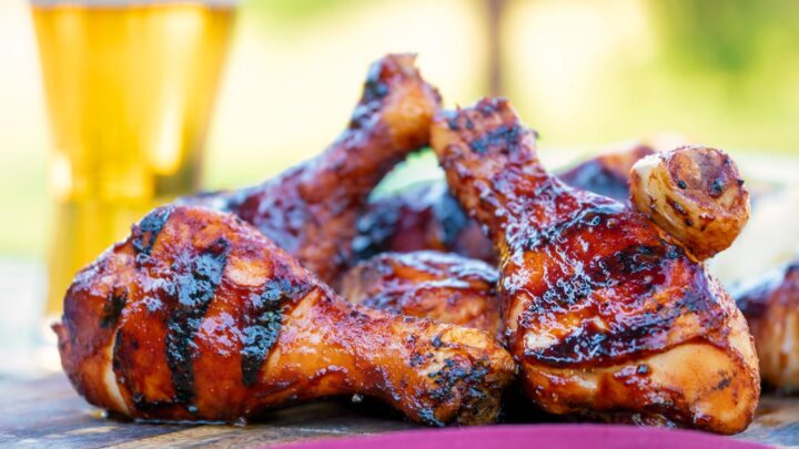 Grilled BBQ chicken drumsticks with a beer, paprika and honey glaze.