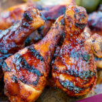 BBQ chicken drumsticks with a beer, paprika and honey glaze served with pickles.