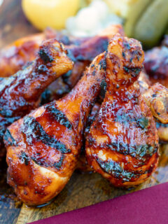 BBQ chicken drumsticks with a beer, paprika and honey glaze served with pickles.
