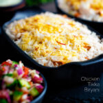 Chicken tikka biryani served in stoneware bowls with kachumber salad and raita featuring a title overlay.