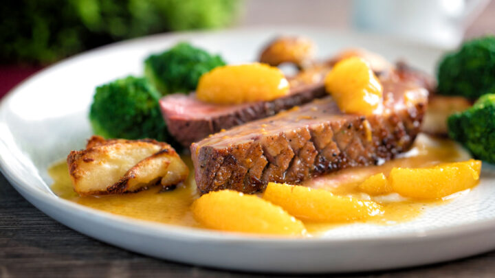 Pan fried duck breast with crispy skin and orange sauce.