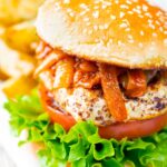 Halloumi burgers with harissa onions served with potato wedges.