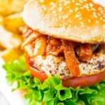 Halloumi burgers with harissa onions served with potato wedges.