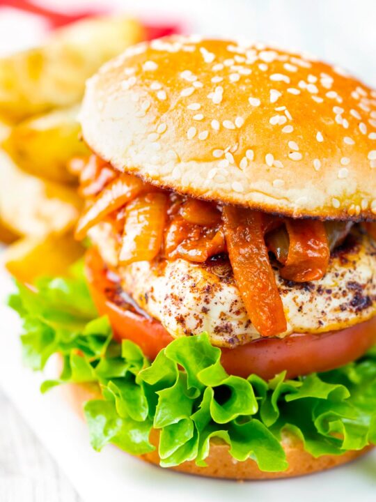 Halloumi burger with harissa onions served with potato wedges.