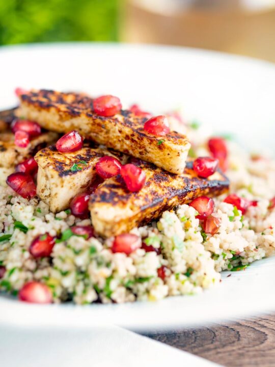 Seared halloumi cheese salad with pomegranate and couscous.