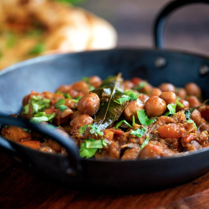 Punjabi chole masala curry or chana masala served in an iron karai.