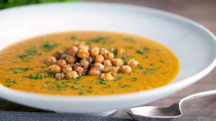 Spicy roasted carrot soup with crispy chickpea croutons.