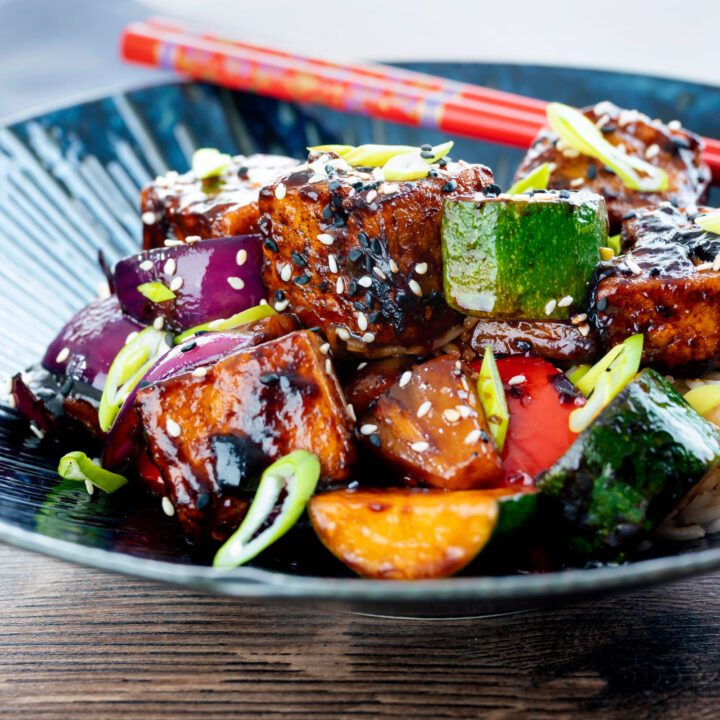 Vegan sweet and sour tofu loaded with vegetables and pineapple.
