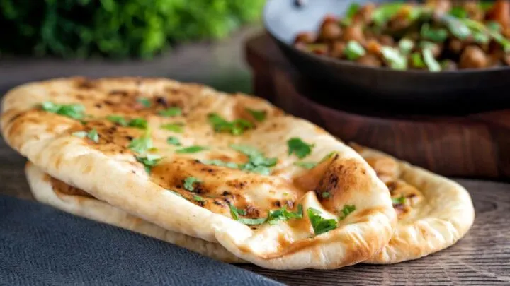 British Curry house style Tandoori naan bread with coriander and ghee.