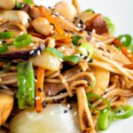 Close up vegetarian mushroom chow mein noodles using 3 types of mushroom.