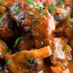 Close up wild boar stew with mushrooms.