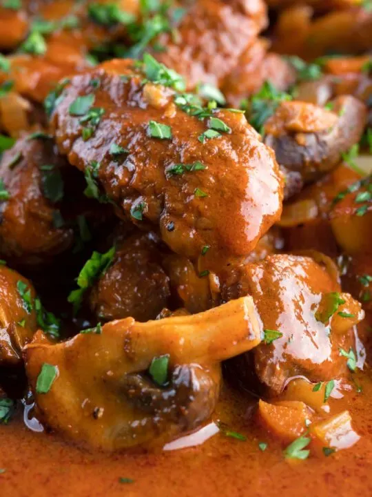 Close up wild boar stew with mushrooms.