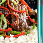 Close up beef in oyster sauce Chinese takeaway stir fry served with rice featuring a title overlay.