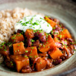 Butternut squash chilli served with brown rice, and sour cream.