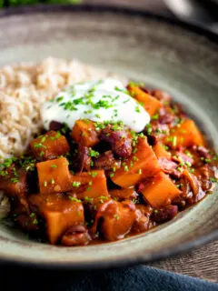 Butternut squash chilli served with brown rice, and sour cream.