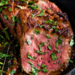 Close up Indian duck breast curry served in an iron karai.