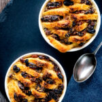 Overhead individual bread and butter puddings.