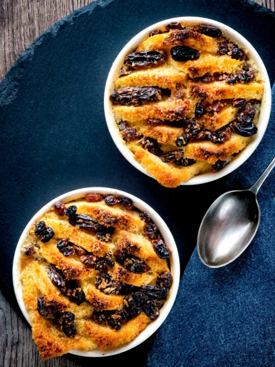 Overhead individual bread and butter puddings.