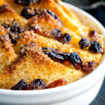 Close up individual bread and butter pudding featuring a title overlay.