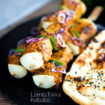 Lamb tikka kebabs with onion and green pepper featuring a title overlay.