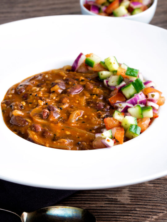 Indian rajma masala kidney bean curry served with kachumber salad.