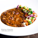 Indian rajma masala kidney bean curry served with kachumber salad featuring a title overlay.