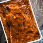 Overhead rakott kaposzta, Hungarian sauerkraut casserole in a casserole dish.