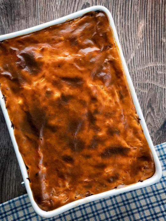 Overhead rakott kaposzta, Hungarian sauerkraut casserole in a casserole dish.