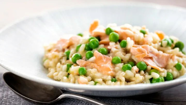 Creamy salmon risotto with green peas and fennel seeds.