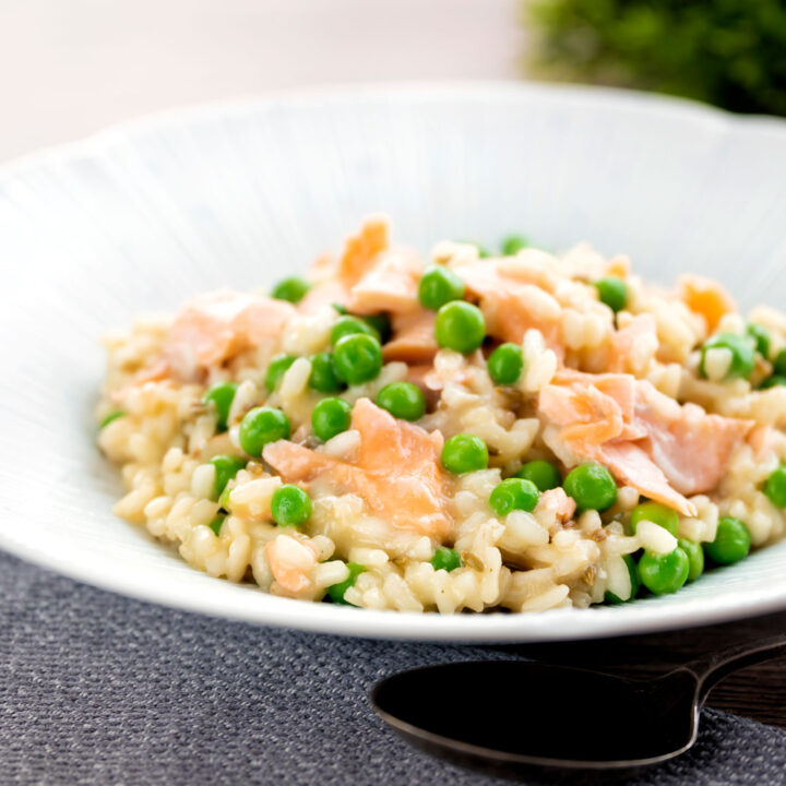 Creamy salmon risotto with green peas and fennel seeds.