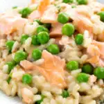 Close up salmon risotto with green peas and fennel seeds featuring a title overlay.