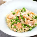 Salmon risotto with green peas and fennel seeds.