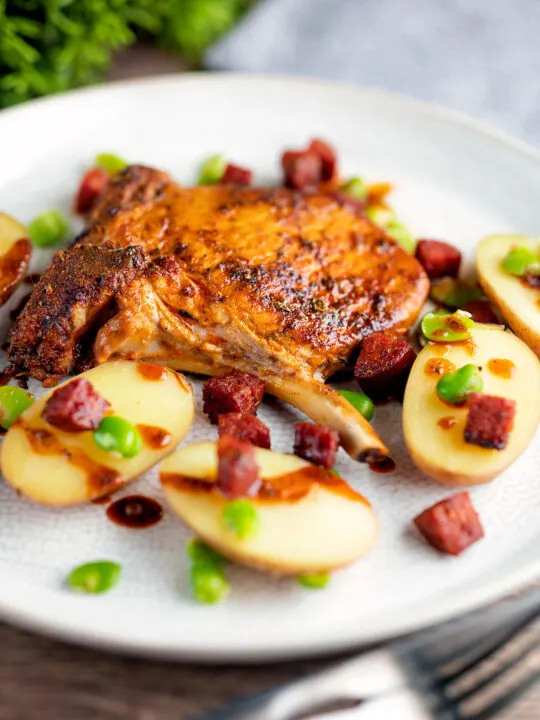 Spanish pork chops with chorizo sausage, broad beans and potatoes.