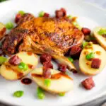 Spanish pork chops with chorizo sausage, broad beans and potatoes featuring a title overlay.