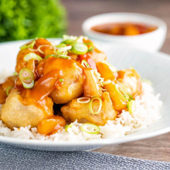 Crispy Chinese sweet and sour pork balls served with white rice.