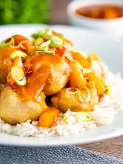 Crispy Chinese pork balls swerved with sweet and sour sauce on rice.