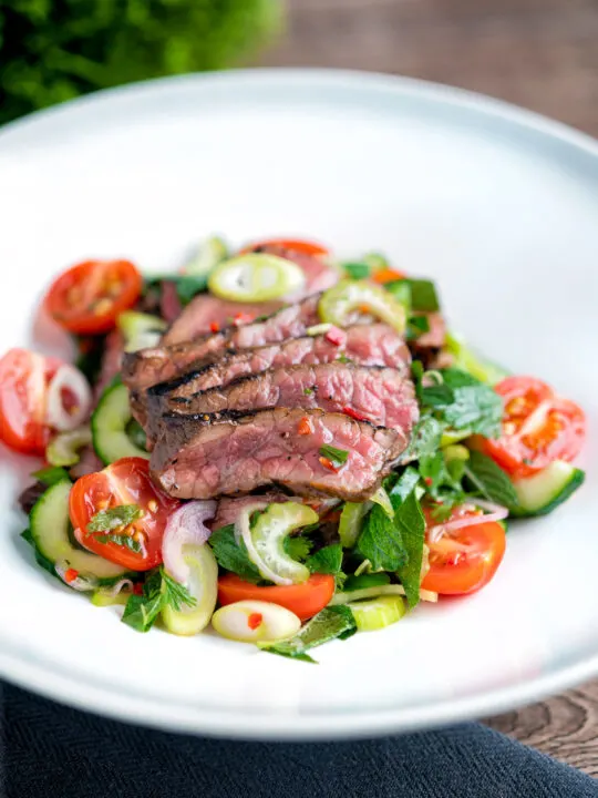 Thai beef salad with rare beef, tomatoes, mint, chilli, shallot, celery and cucumber.